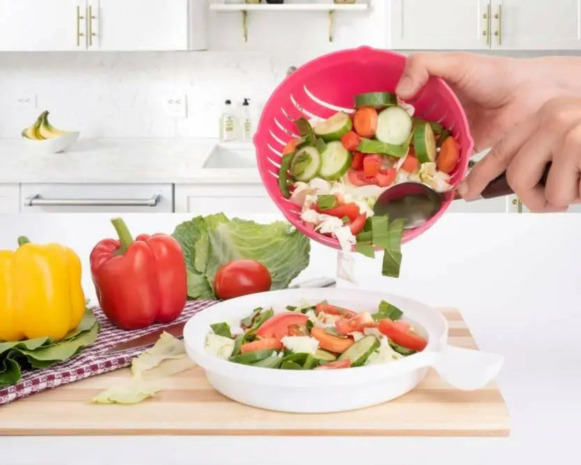 Vegetables are pored in the vegetable cutter salad bowl