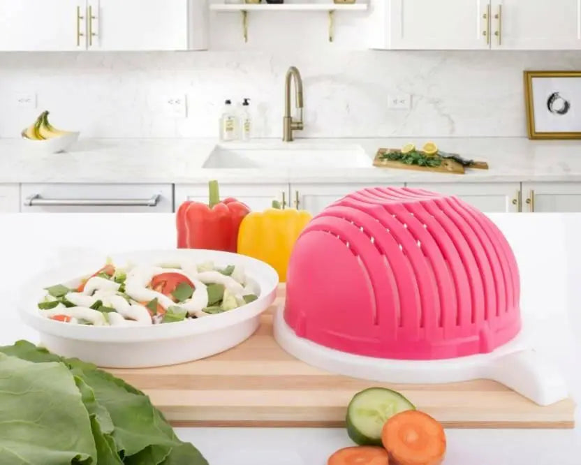 salad bowl on table with some chopped vegetables on the table